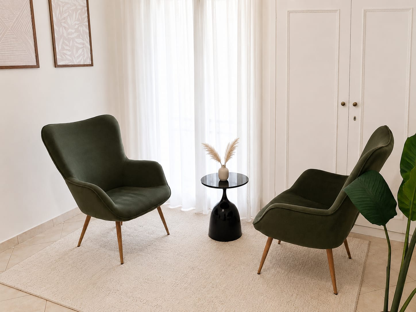 The practice room in Athens: two green armchairs by a window